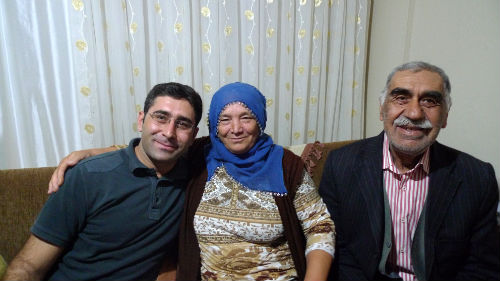 Ali with his mother and father